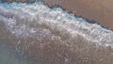 Empty beach with waves rolling on coast washing soft sand Video stock 170484533