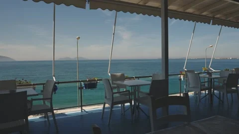 Empty Beachfront Balcony Cafe with Calm and Turquoise Mediterranean Sea Stock Footage 245997203