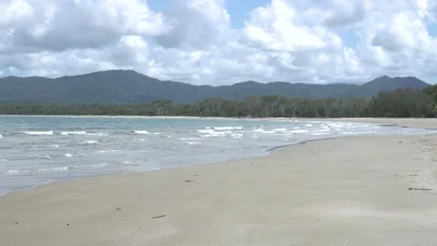 Empty beautiful beach due to coronavirus, sunny day, waves crashing on beach 스톡 동영상 132170216