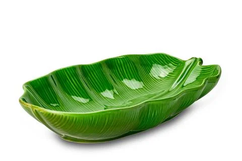 Empty beautiful green leaf shape ceramic bowl isolated on white background... Stock Photos