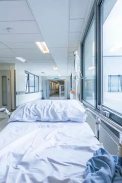Empty bed gurney in hospital corridor Stock Photos