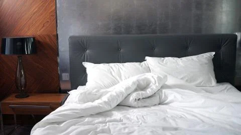 Empty bed spread, waking up good morning Stock Photos