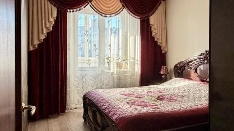 Empty bedroom interior with bed and window in residential apartment Stock Photos