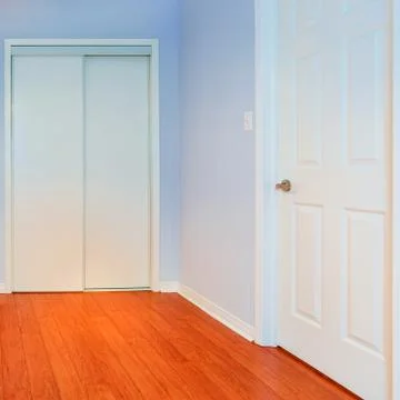 Empty bedroom in a new apartment Stock Photos