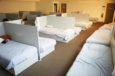 Empty Beds In Homeless Shelter Stock Photos