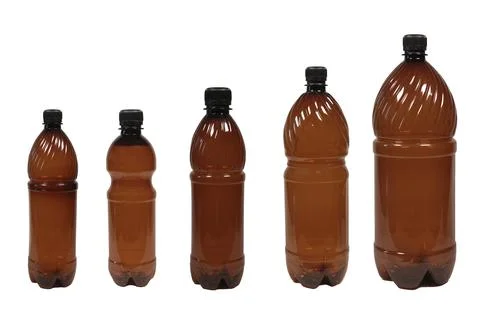 Empty beer bottles with cap. dark plastic bottle of water isolated on a white Foto stock