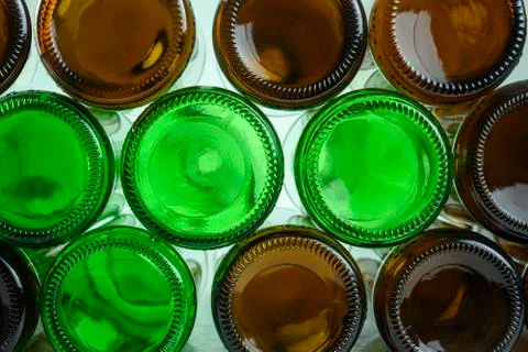 Empty beer bottles lie on top of each other Stock Photos