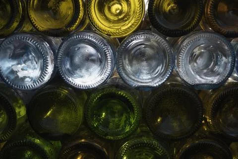 Empty beer bottles rack. Full frame. Alcohol theme. Stock Photos