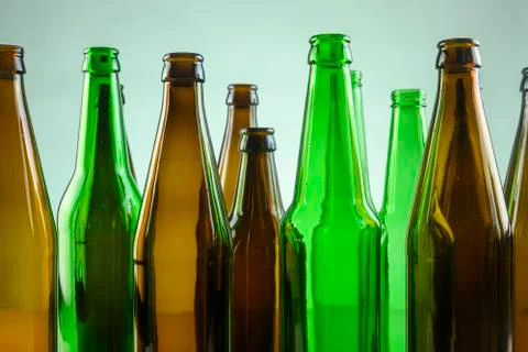 Empty beer bottles stand on a white background Stock Photos