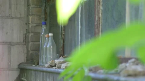 Empty Beer Bottles on the windowstill in 4K Slow motion 60fps Video stock 133629791