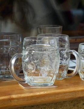 Empty beer glasses Stock Photos