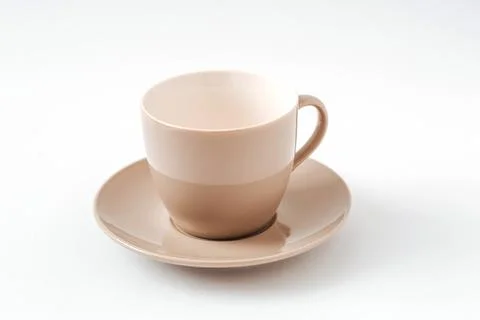 Empty beige coffee ceramic cup and saucer on isolated white background, cut out Stock Photos