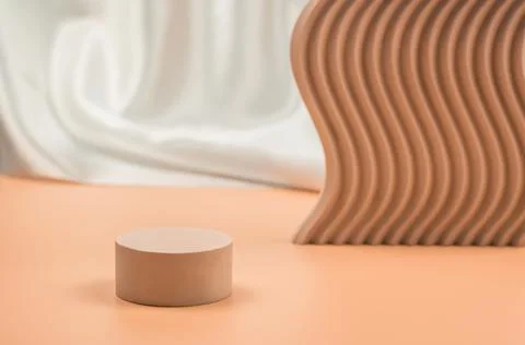 Empty beige podium on a beige background with geometric shapes Stock Photos