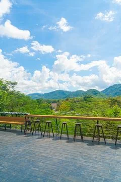 Empty bench and bar stool on balcony Stock Photos