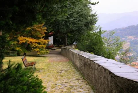 Empty bench in Citta Alta park in Bergamo, Italy Stock Photos
