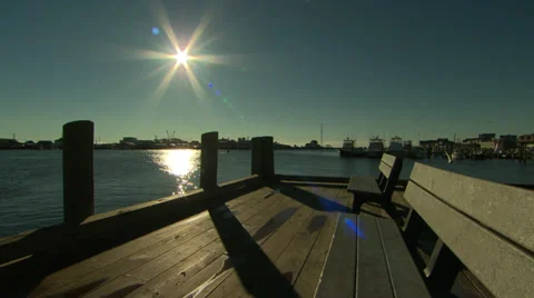 Empty bench on a dock in sunshine Stock-Footage 36478520