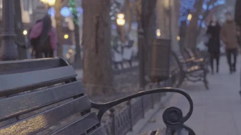 Empty bench in evening park with bright christmas decoration light illumination  Stock Footage 132674044