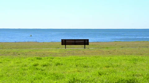 Empty bench facing the sea Stock Footage 64206929