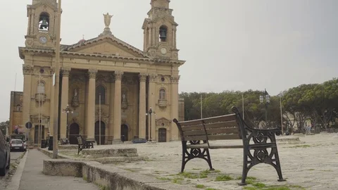 An Empty bench in front of a beautiful church Stock Footage 74442048
