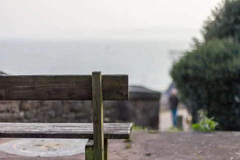 Empty bench looking out at the sea Stock Photos