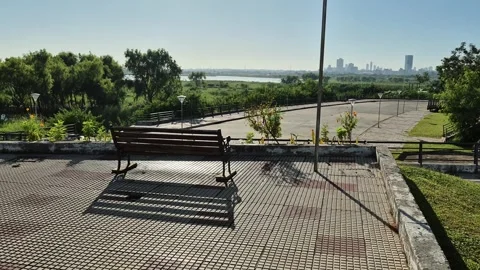 Empty Bench Overlooking Asuncion Skyline and Riverside Landscape in Paraguay 스톡 동영상 335379992