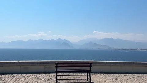 Empty Bench Overlooking Mediterranean Sea and Beydaglari Mountains in Antalya Stock Footage 344532877