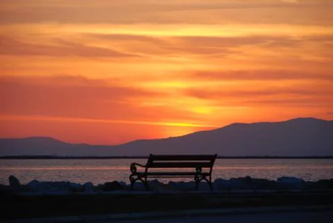 Empty bench overlooking the sunset of izmir, Turkey Stock Photos