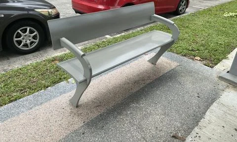Empty bench seat on the walking path outdoor Stock Photos