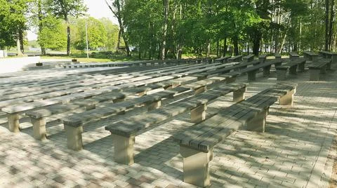 Empty bench seats for watching performances in the park.  Stock Photos