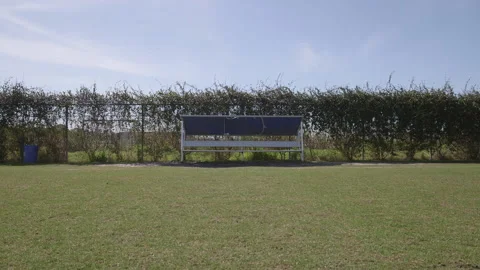Empty Bench on the Side of a Field Stock Footage 141086656