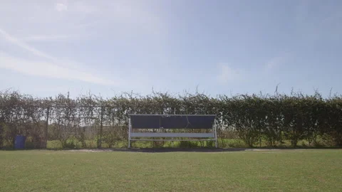 Empty Bench on the Side of a Field Video stock 141086802