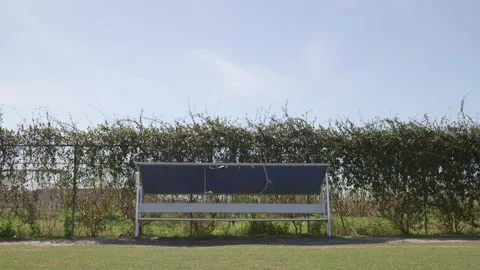 Empty Bench on the Side of a Field Stock Footage 141087218