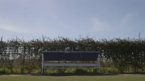 Empty Bench on the Side of a Field Stock Footage 141087322