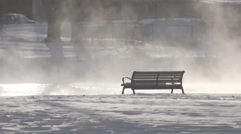Empty bench by steaming river (handheld) Stock Footage 33893479