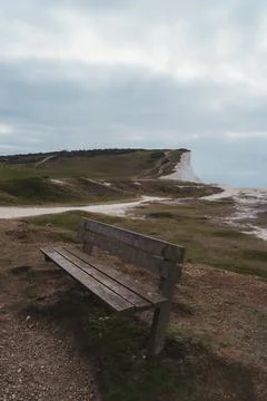 Empty bench on the top of chalk cliffs at Seaford Head. Seven Sisters, South  Stock Photos