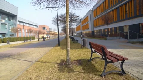 Empty bench by walking path on abandoned Jagiellonian University campus. Stock Footage 150902654