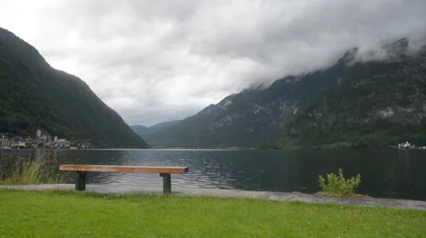 Empty bench on water's edge in park. Stock Footage 52282810