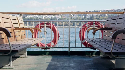 Empty benches on board pleasure ferry. passenger boat floats in bay or strait Stock Footage 220996672