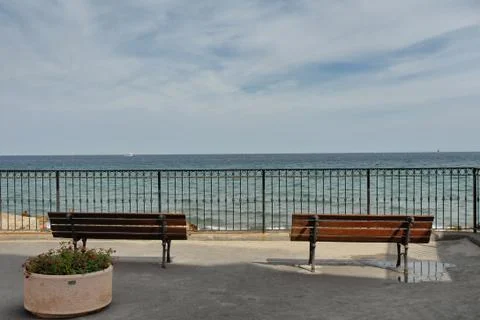 Empty benches facing the sea Foto stock
