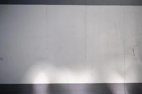 Empty Berlin Wall graffiti mockup. Grey concrete wall with sun light and shadows Stock Photos