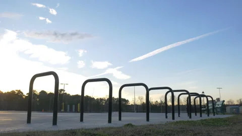 Empty bike rack in a park at sunset Видео 233186378