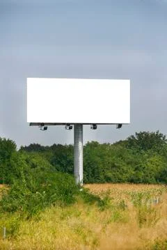 Empty billboard on background of sunset sky Stock Photos