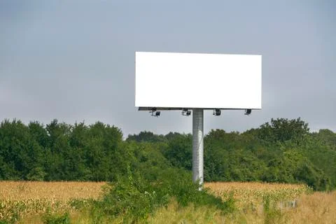 Empty billboard on background of sunset sky Stock Photos