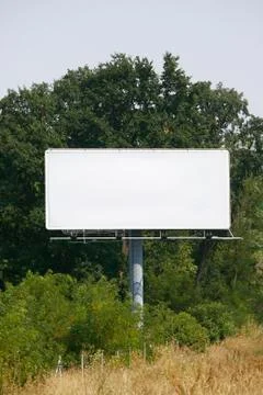 Empty billboard on background of sunset sky Stock Photos