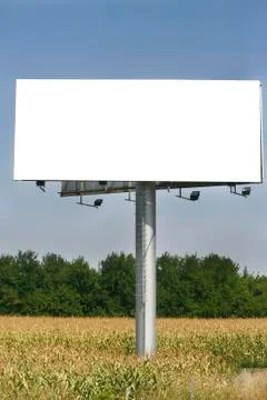 Empty billboard on background of sunset sky Stock Photos