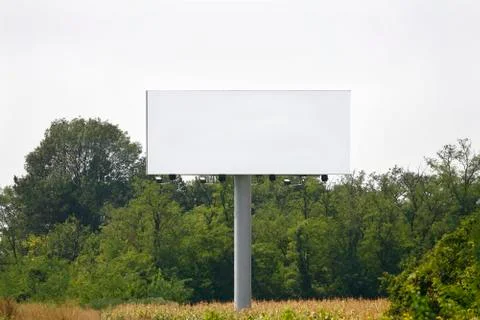 Empty billboard on background of sunset sky Stock Photos
