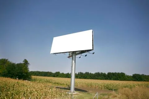 Empty billboard on background of sunset sky Stock Photos