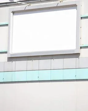 Empty billboard on building wall with modern architecture Stock Photos