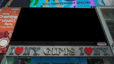 An empty billboard in the bustling Times Square during the day Stock Footage 293760614