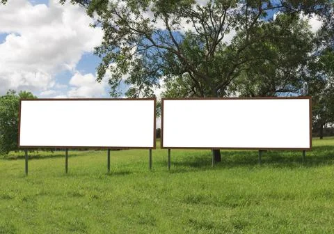 Empty billboard in front of beautiful cloudy sky in a rural location 스톡 사진
